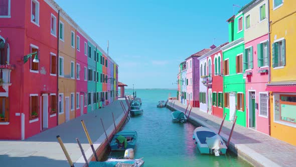 Bright Colorful Houses in Row on Narrow Lagoon Canal Banks