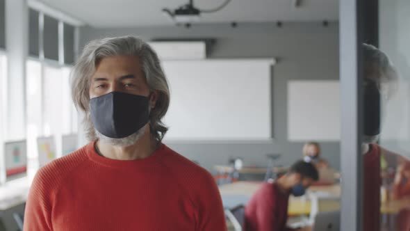 Portrait of Senior Male Office Worker in Protective Mask