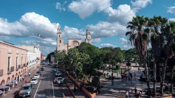 Speed ramped time lapse of the Plaza Grande with cathedral and municipal building in Merida, Mexico.