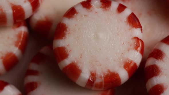 Rotating shot of peppermint candies - CANDY PEPPERMINT 055