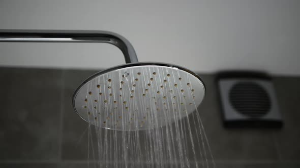 Turning On The Shower. Modern Shower Head With Water Flow.