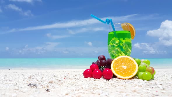 Natural flying travel shot of a white sand paradise beach and aqua blue ocean background in colourfu