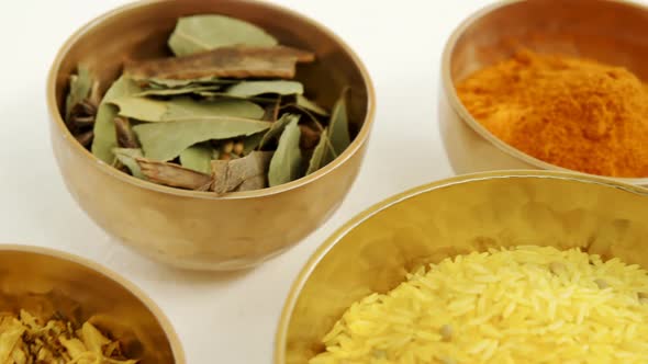 Various spices in bowl on white background 4k