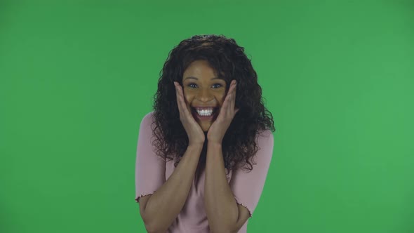 Portrait of Beautiful African American Young Woman Is Looking at Camera with Shocked and Surprised