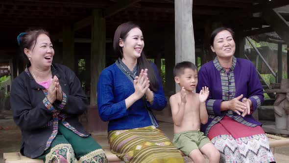 Happy Asian Family Clapping Hands