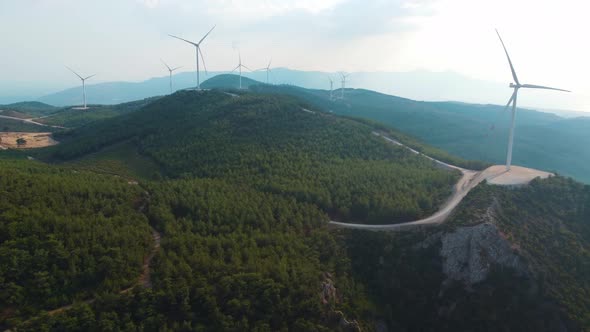Wind generators on the top of the mountain generate clean energy.