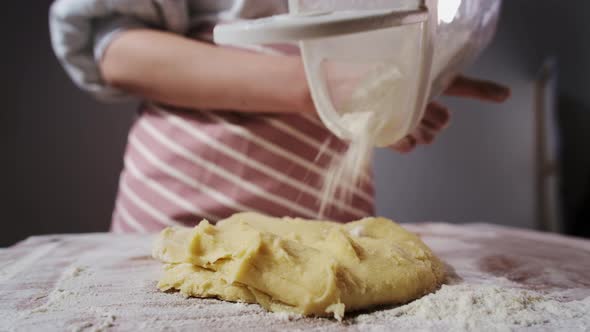 Woman Adds Flour to Sweet Homemade Gingerbread Dough