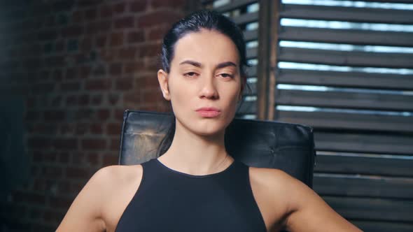 Attractive Face of Mixed Race Young Female Mma Fighter Posing at Boxing Gym Looking at Camera