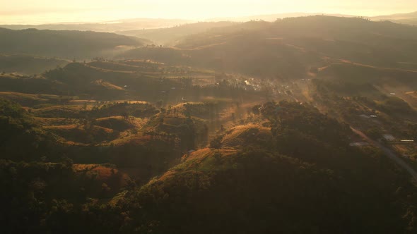 4K Morning mist over a rural village in the high mountains.