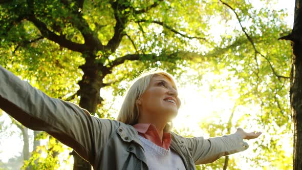 Happy woman in park