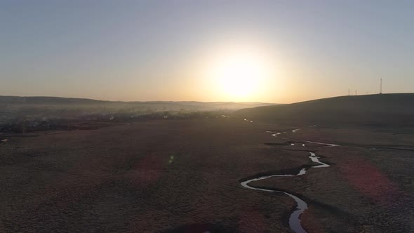 Flying In Sun Rays Over River