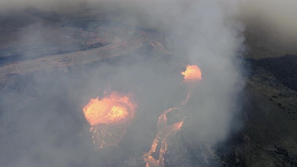 Aerial view over a spawning lava basin, in Geldingardalur - tilt, drone shot