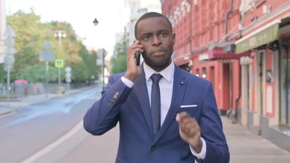 Outdoor Walking African Businessman Talking on Phone