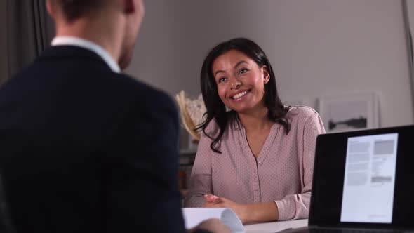 Woman Job Candidate Talks to Recruit Man in Office and Smiles