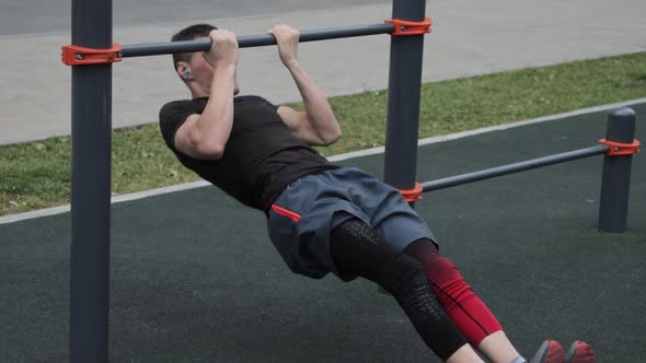 Man training outdoors on sports field