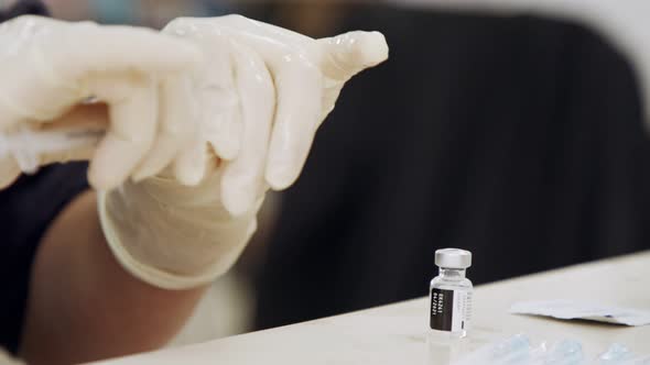 Paramedic giving people the COVID-19 vaccine injection during the vaccination operation