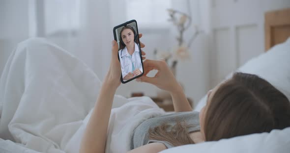 Female Using Online Chat To Talk with Family Therapist and Checks Possible Symptoms During Pandemic