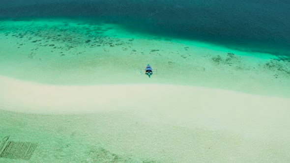 Sandy Beach in the Lagoon with Turquoise Water