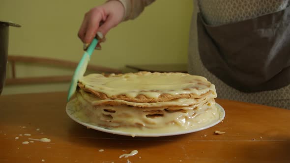 Female Is Cooking A Cake