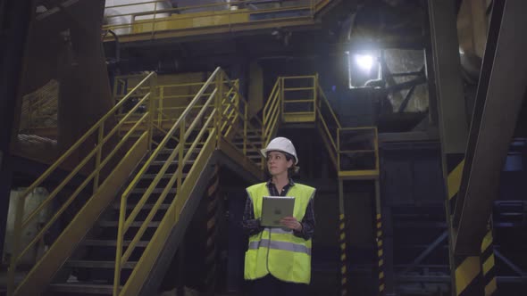 Caucasian Female Engineer Working at Mineral Wool Plant