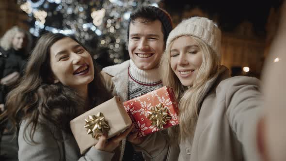 Happy Multicultural Friends Taking Selfie at Xmas Night