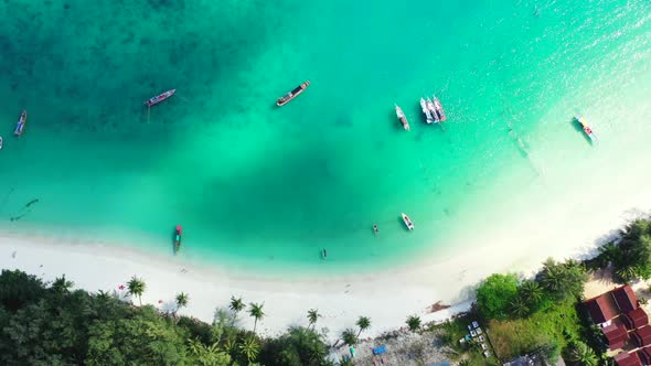 Aerial travel of marine island beach voyage by aqua blue water and white sand background of a dayout