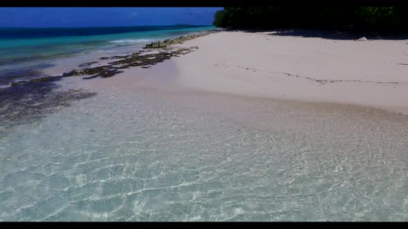 Aerial seascape of relaxing lagoon beach time by blue green ocean and white sand background of journ