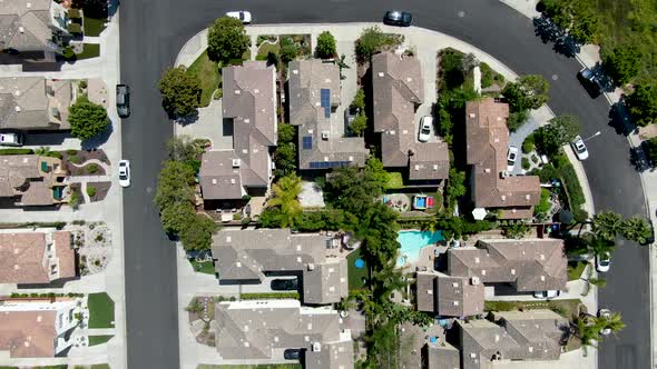 Aerial Top View of Upper Middle Class Neighborhood with Residential Houses and Pool