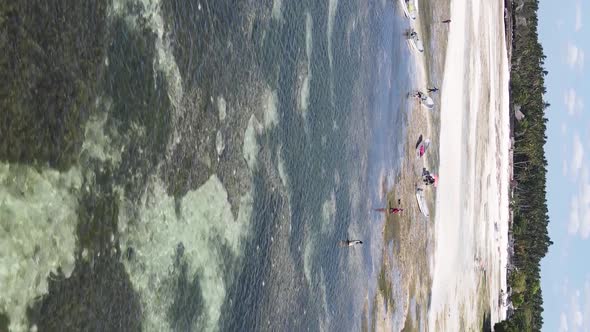 Vertical Video of Low Tide in the Ocean Near the Coast of Zanzibar Tanzania Aerial View