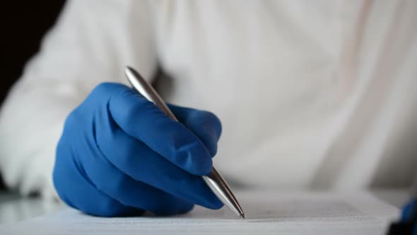 the Doctor in the Hospital Checks the History of the Patient's Illness