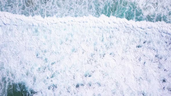 Strong blue waves in ocean crashing on the shore. Maroubra Beach, Sydney. Beautiful drone view on cl