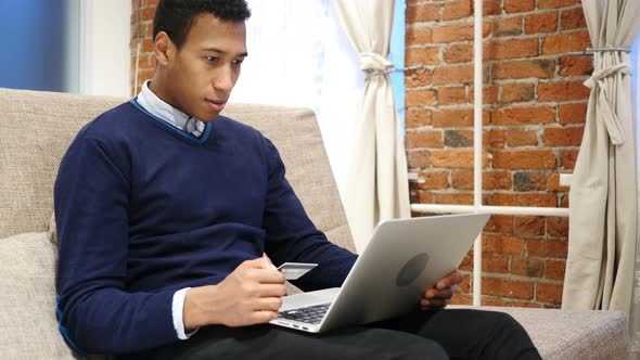 African Man Excited for Successful Online Shopping, Transaction