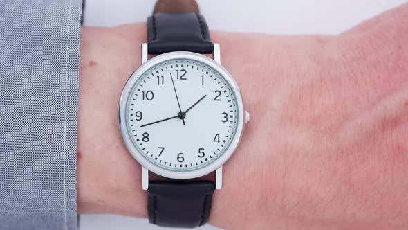 Close up of a man wearing a wrist watch