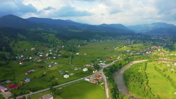 Aerial View of a Green Rural Area Under Blue Sky