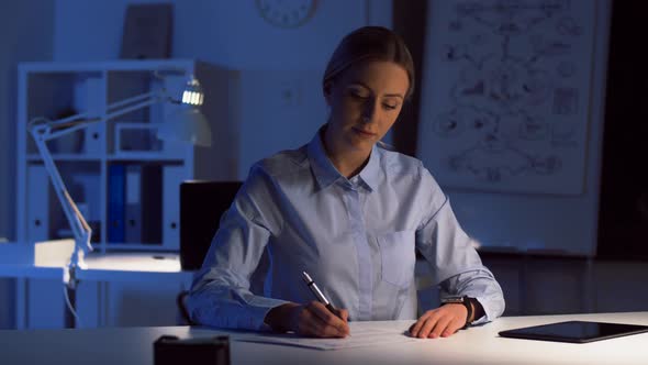 Businesswoman with Smart Watch at Night Office 99