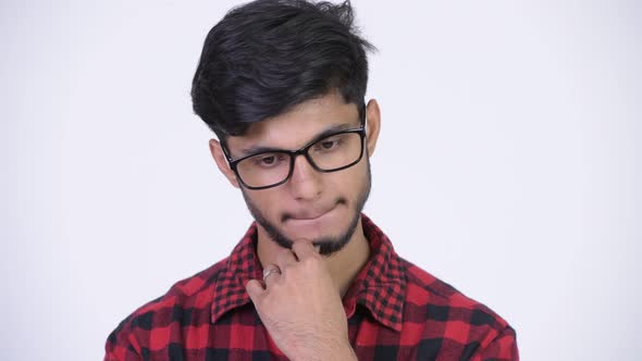 Young Stressed Bearded Indian Hipster Man Thinking