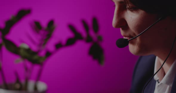 Businessman Wearing Headset Working in Office