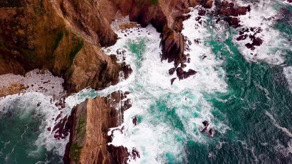 Turquoise Ocean Waves Crash On Big Cliffs in Big Sur Cali, Drone Orbit