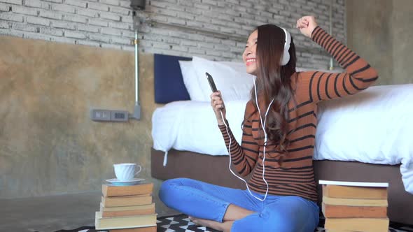 Woman use smart phone for listen music