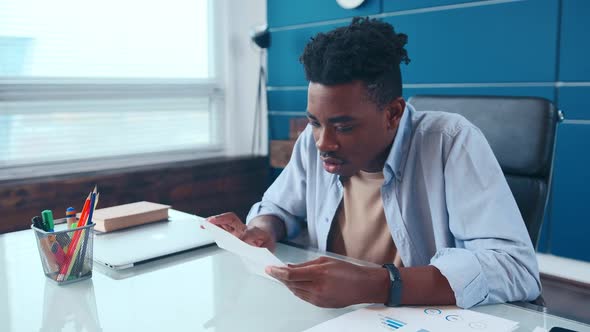 Excited African American Man Executive Receiving Mail with Salary Growth Payment