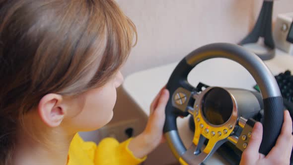 Girl Playing Races On The Computer