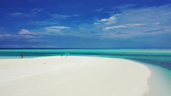 Daytime birds eye copy space shot of a paradise sunny white sand beach and blue ocean background in 