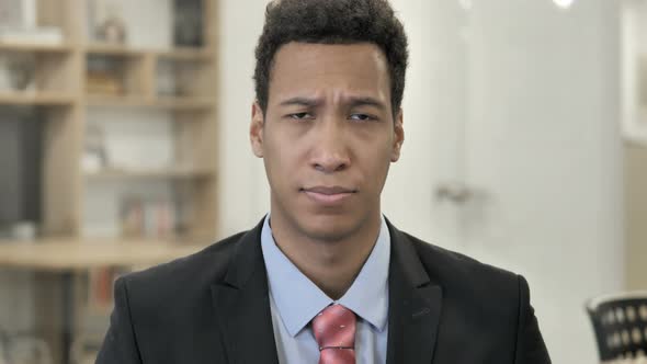 Portrait of Sad African Businessman Upset By Loss