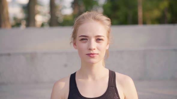 Sport and Fitness Young Adult Caucasian Woman Resting After Morning Workout Outdoor Summer Park