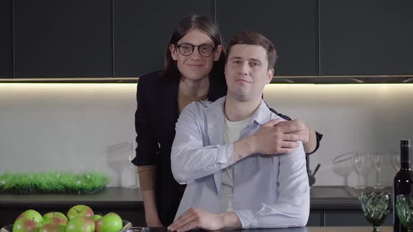 Portrait of Adult Caucasian Gay Couple Looking at Camera and Smiling. Camera Approaches To Smiling