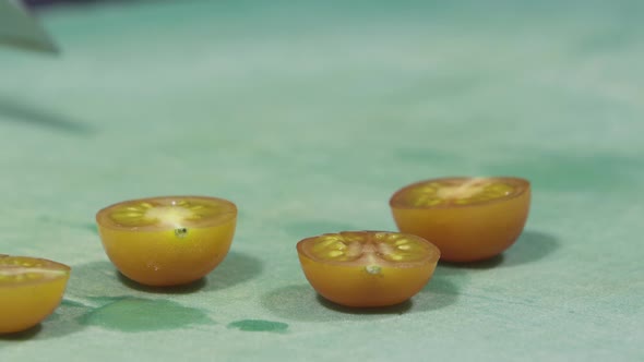 Cook's Hands in Black Gloves Chopping Tomatoes Close Up