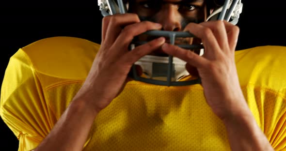 American football player with a head gear