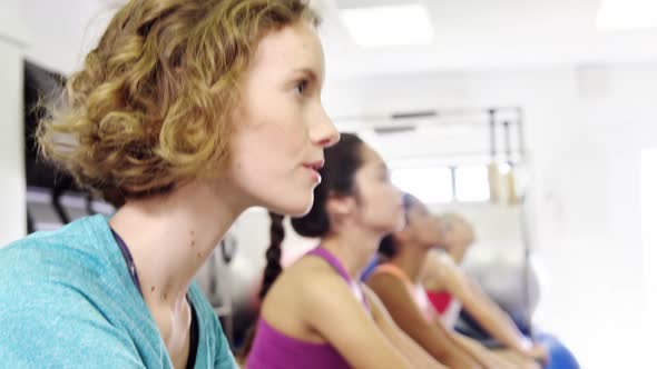 Beautiful women exercising in fitness studio