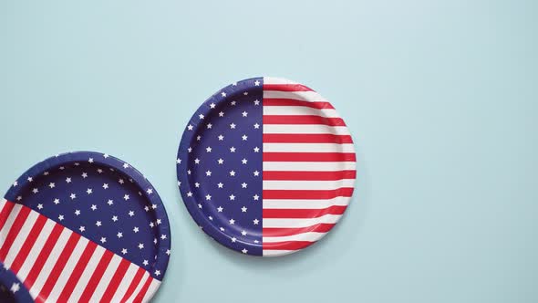 July 4th theme paper plate on blue background.