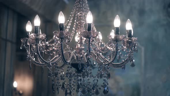Beautiful Chandelier, with Transparent Pendants and Burning Lamps